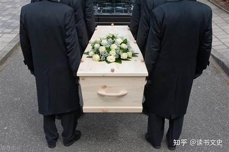 梦到人死放到棺材里面